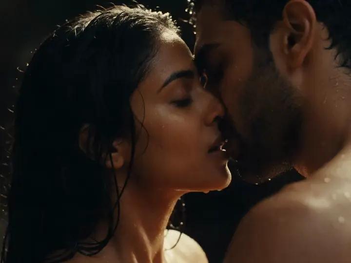 A couple leans closer under warm amber light with water glistening.